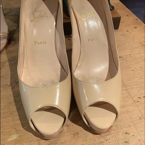 Louboutin nude platform heels.